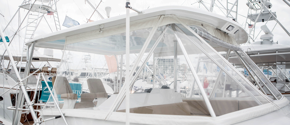 A boat's cockpit covered by a clear mesh