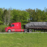 A sheet of fabric draped over a truck