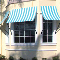 An awning made of striped green and white fabric in front of a building